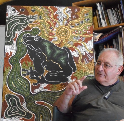 Uncle Les Elvin paints the Wollombi Frog Story in his Cessnock Studio